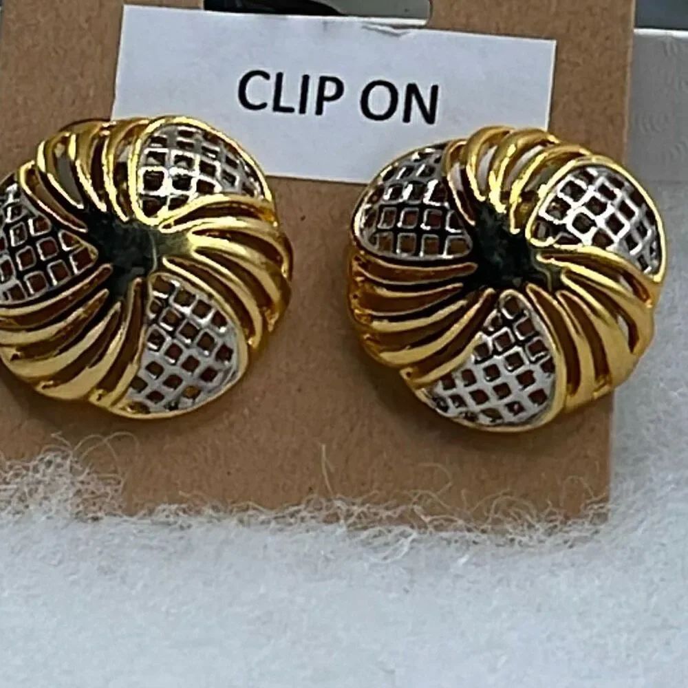 Vintage open cut gold silver tone clip earrings.